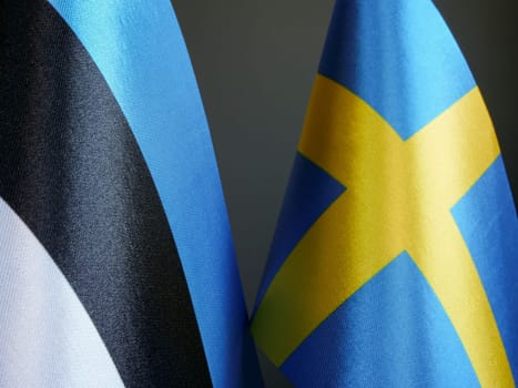 Flags of Estonia and Sweden.