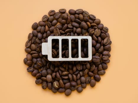 Coffee beans and battery symbol for cheerfulness and energy. Contemporary art.
