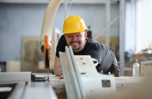 Worker using electric saw portrait. Manual job workplace DIY inspiration improvement fix shop yellow helmet hard hat joinery startup idea industrial education profession career concept