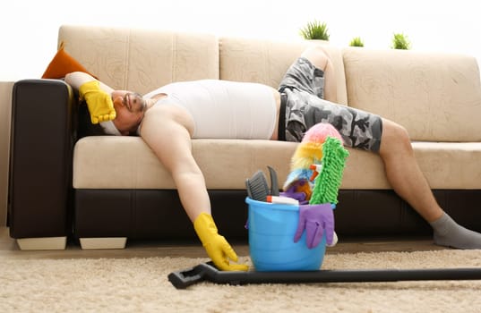 The man was left alone at home tired of cleaning and fell asleep