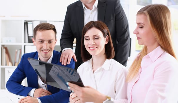 Group of people in office look at mobile tablet pc. Funny internet video white collar colleague share job plan at workplace busy lifestyle corporate style new worker interview web search concept