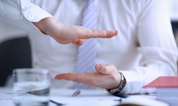 Male arms articulating during conference conversation in office closeup. Suggestion illustrate offer proposition bribe demand concept