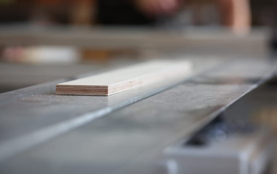 Wooden bars lying in a row closeup background. DIY job inspiration improvement fix shop powersaw bench joinery startup workplace idea career ruler industrial education