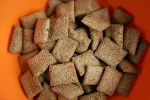 delicious chocolate cereal in orange bowl