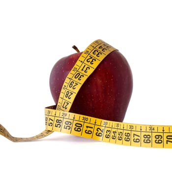red apple and measure tape