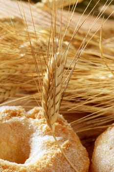 Delicious roll bakery with sugar and wheat ear spikes