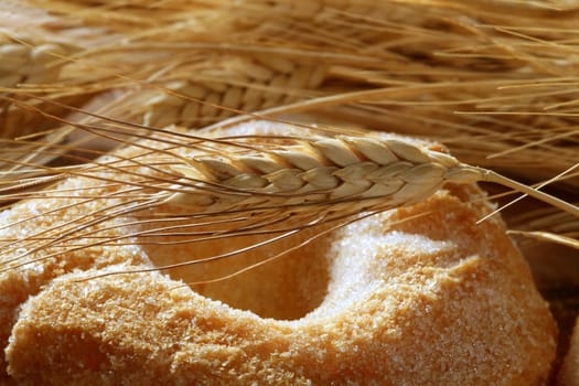 Delicious roll bakery with sugar and wheat ear spikes