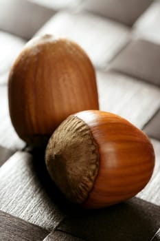 Delicious hazelnuts, macro detail, warm golden light, studio shot