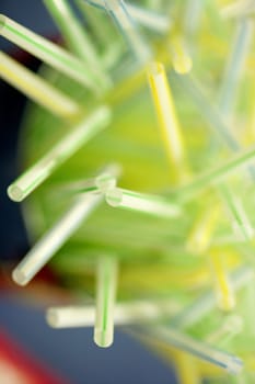 drinking straws still going to blur, yellow and green colors