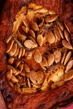Oven baked pumpkin with seeds, golden macro food