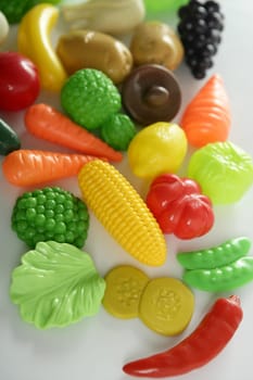 Plastic game, fake varied vegetables and fruits. Children food education toy