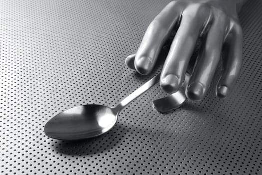 gray silver hand and spoon futuristic food modern metaphor