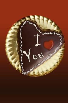 chocolate heart shape cake on golden plate valentines day