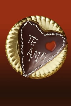 chocolate heart shape cake on golden plate valentines day