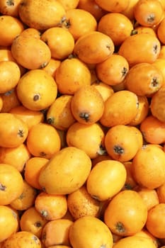medlar fruits pattern background texture on market