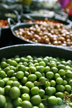 olives in pickling brine pattern background texture in market
