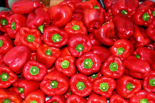 Red pepper stacked in market as pattern background vegetables