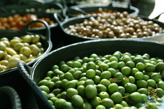 olives in pickling brine pattern background texture in market