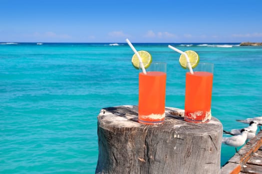 beach orange cocktail in Caribbean turquoise beach