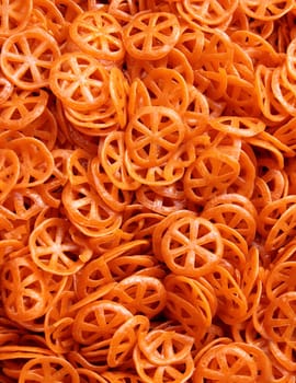 dried round pasta wheels in messy texture