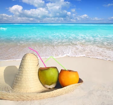 Coconuts in Caribbean beach on mexico sombrero with tropical turquoise sea horizon