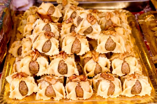 arab sweet pastries cakes stacked bakery with nuts
