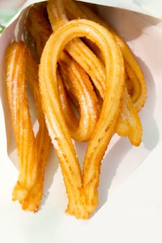 churros fried crullers spanish flour fritters in paper cone