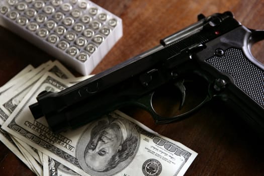Dollar notes and gun, black pistol, mafia inspiration