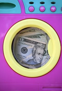 Cleaning black money dollar metaphor, laundry toy wahing machine