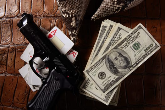 Dollar notes and gun, black pistol, mafia inspiration