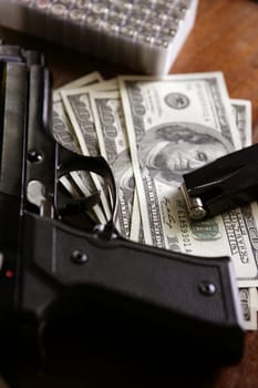 Dollar notes and gun, black pistol, mafia inspiration