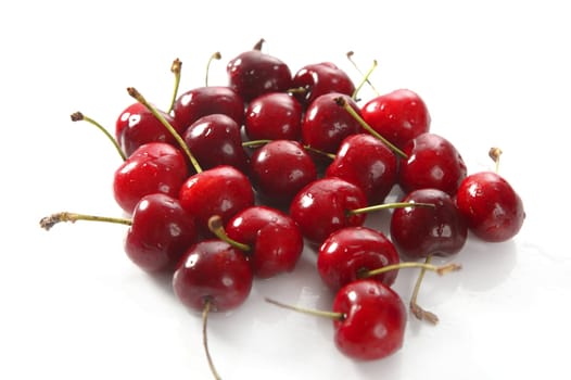 cherry red wet fruits macro on white studio isolated