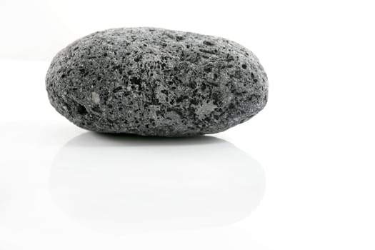 Volcanic Pumice, black and white textured stone over white