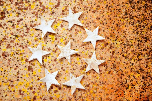 christmas stars background on recycled warm paper