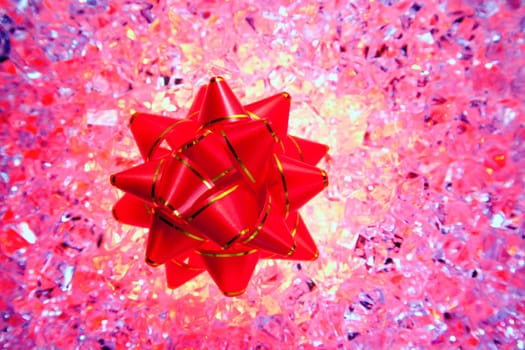 christmas gift ribbon on pink ice background