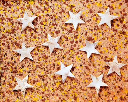 christmas stars background on recycled warm paper
