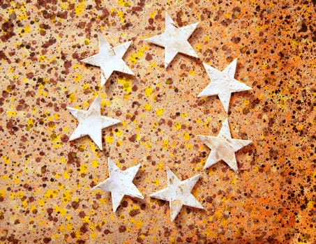 christmas stars background on recycled warm paper