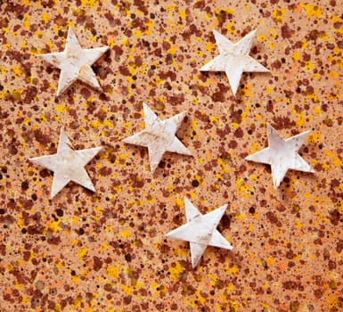 christmas stars background on recycled warm paper