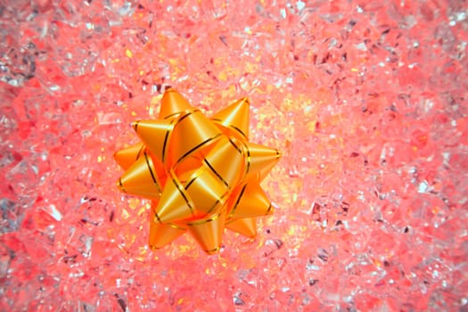 christmas gift golden ribbon on red ice background