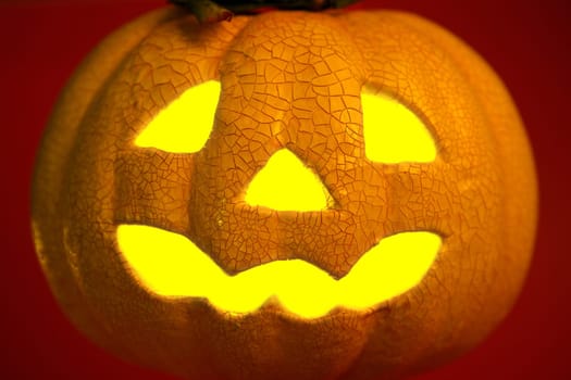Glowing yellow light inside an orange halloween pumpkin