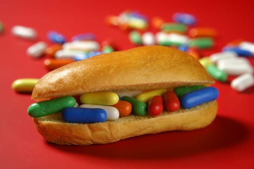 Sandwich made of colorful candy sweet, children favourites menu over red