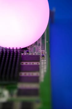 Glowing light sphere lighting a technologic electronic circuit