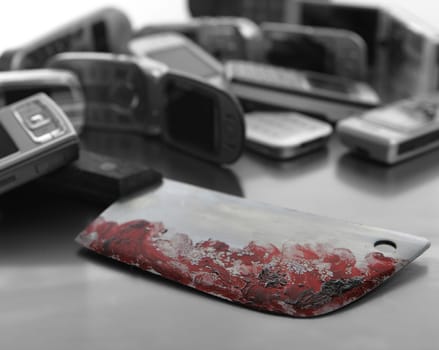 Assorted mobile phones with bloody knife weapon. The murcer scene of a serial killer