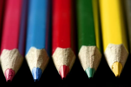 Colorful set of pen in vibrant colors over black background
