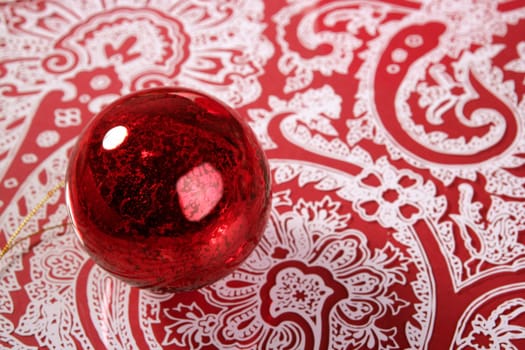 Chrsitmas red ball over indian pattern background