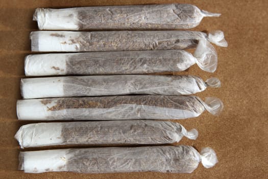 joint cigarettes hand rolled in row tobacco closeup