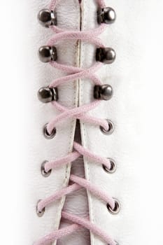 Closed white long boot pink thread closing concept metaphor