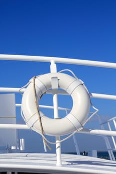 boat buoy white hanged in railing summer vacation blue sky