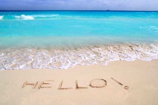 Hello message spell written in tropical beach sand Caribbean turquoise sea