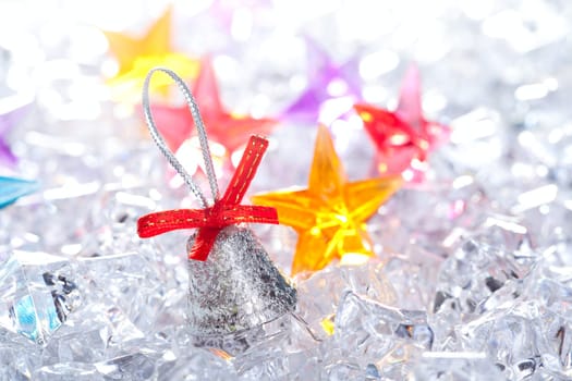 christmas silver bell on winter ice background